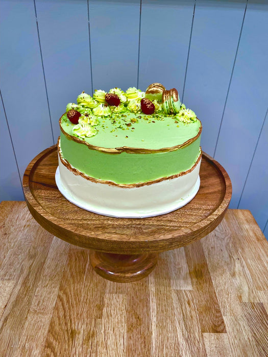 Pistachio & Raspberry Sponge Cake Topped With Macarons & Gold Flake Finish